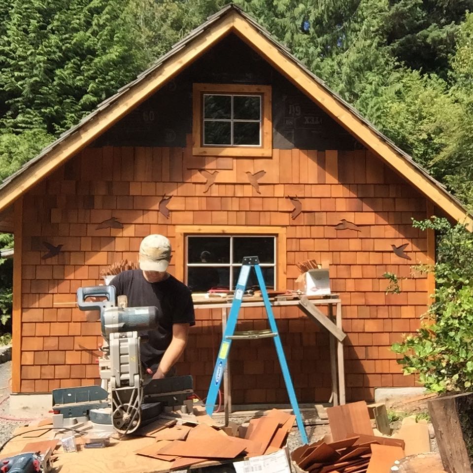 handcrafted cedar shingle siding with whimsical playhouse design