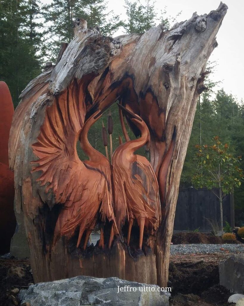 Birds carved into redwood