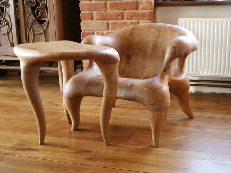 Carved oak armchair with table