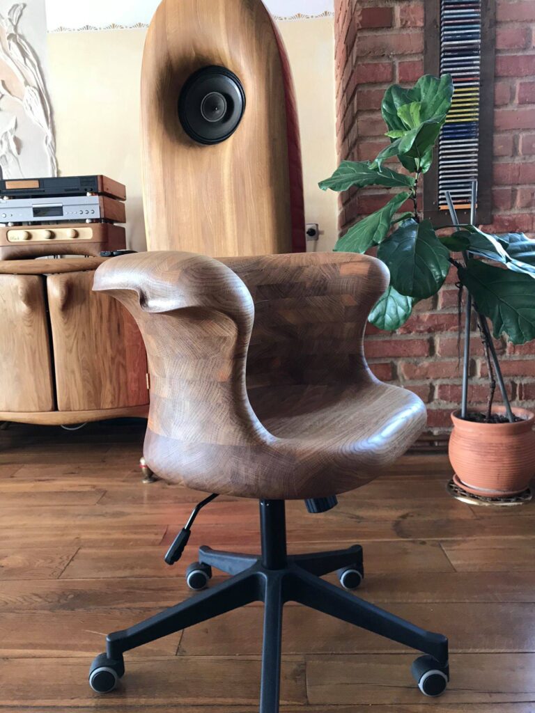 Carved oak work chair on wheels