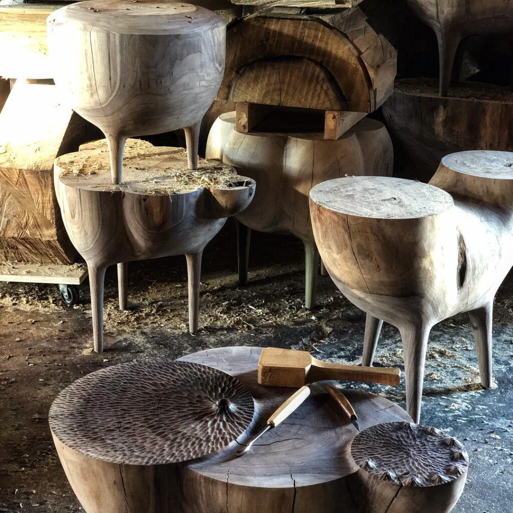 Various carved stools and tables