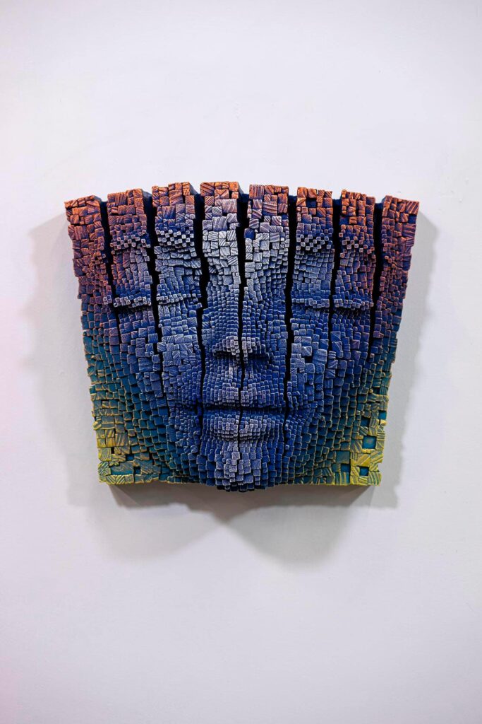 Human face sculpture seperating apart