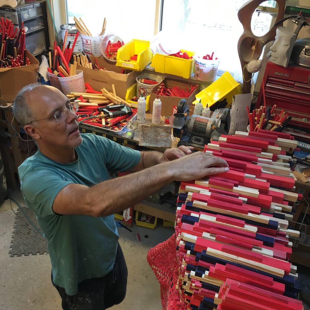 Gil Bruvel working on his sculpture