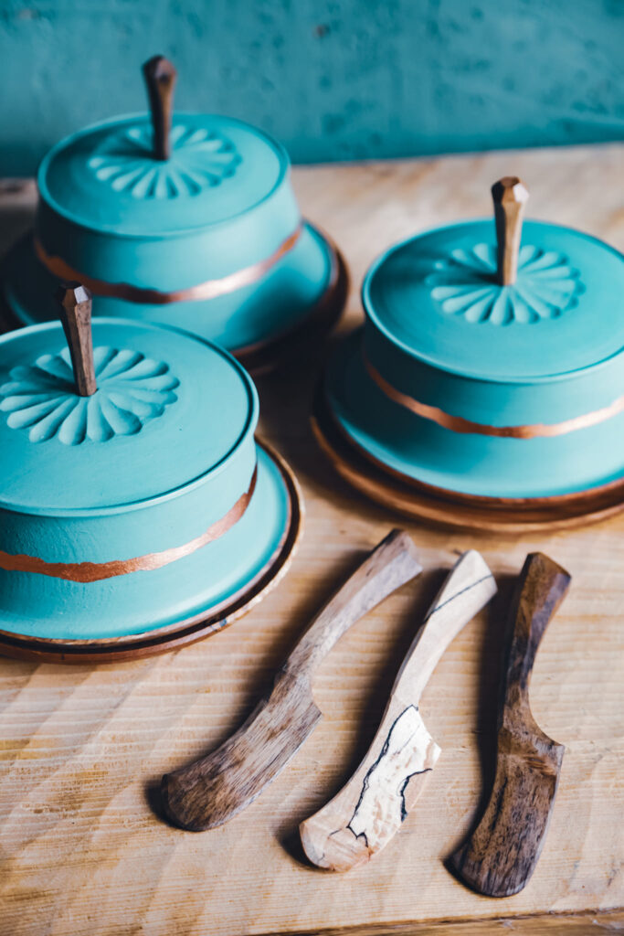 Carved wood butter trays with butter knives