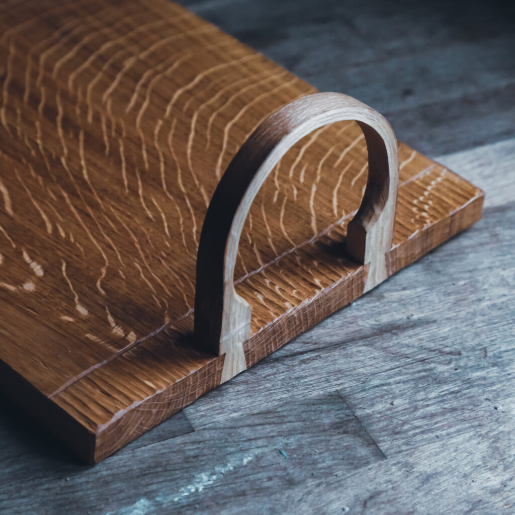 Carved oak serving tray with bent wood handles