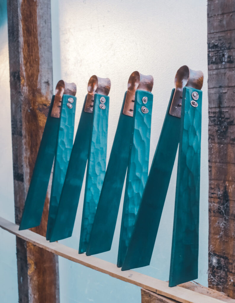 Carved wood and copper tongs