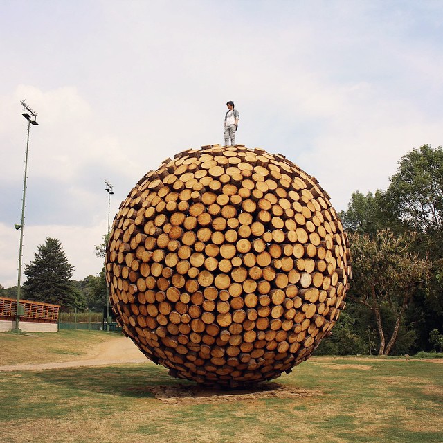 Jaehyo Lee on top of his sculpture
