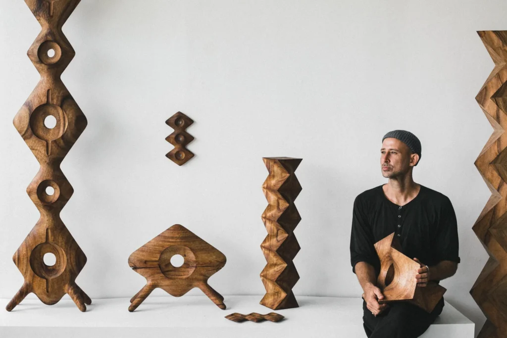 Aleph Geddis with his sculptures