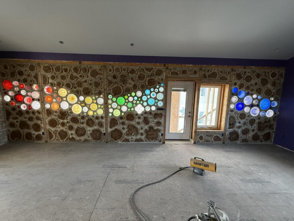 Cordwood and stained glass wall