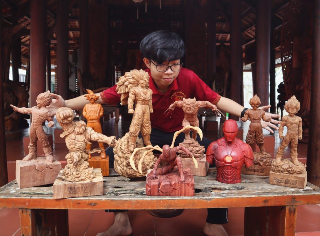 Woodart vietnam owner with his own carved sculptures