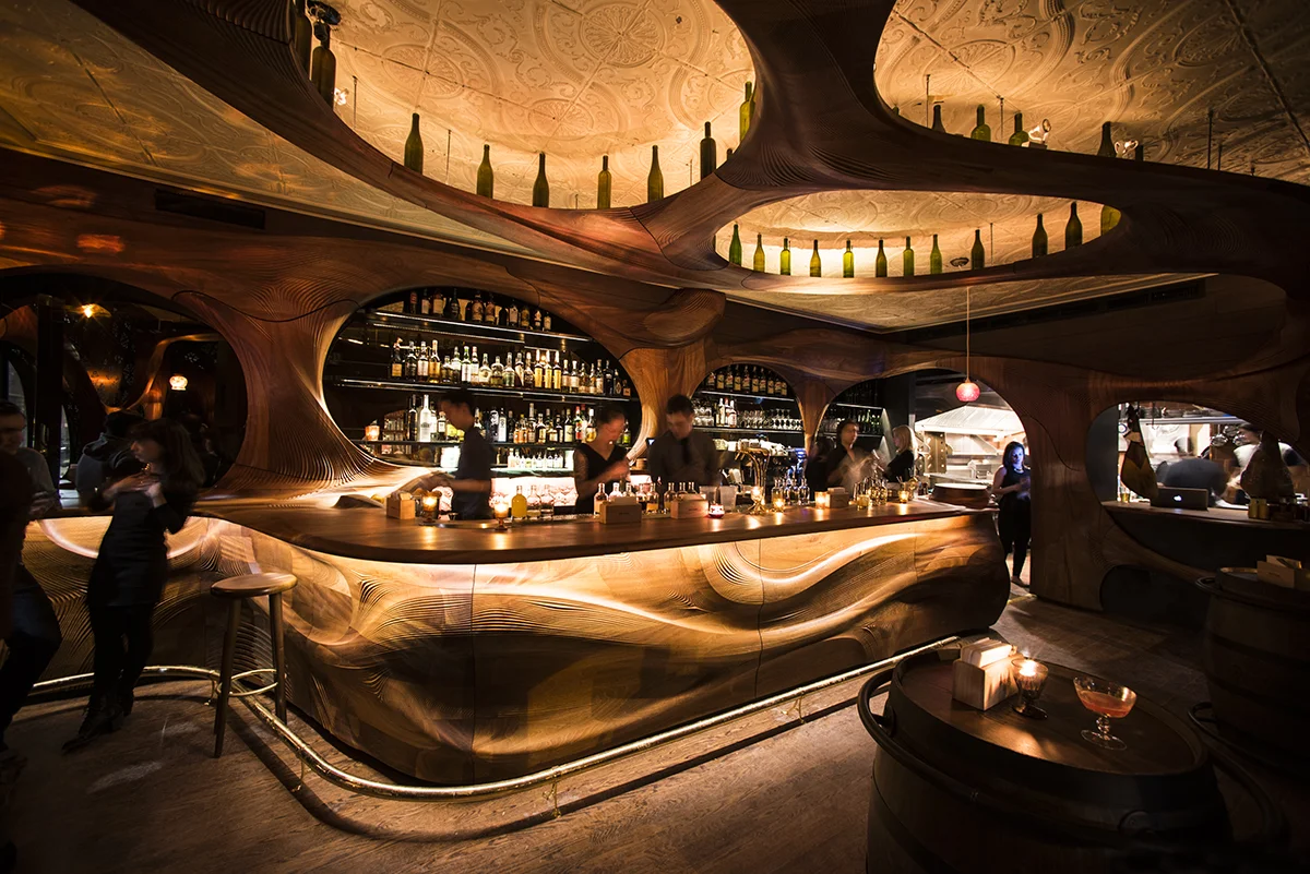 Bar Raval and the Sculpted Mahogany Interior by Partisans
