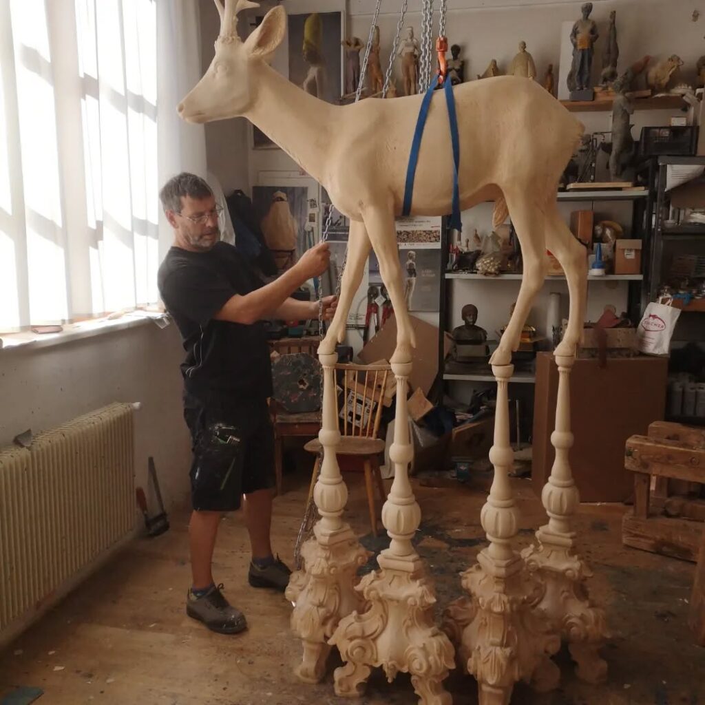 Willy Verginer with his sculpture 